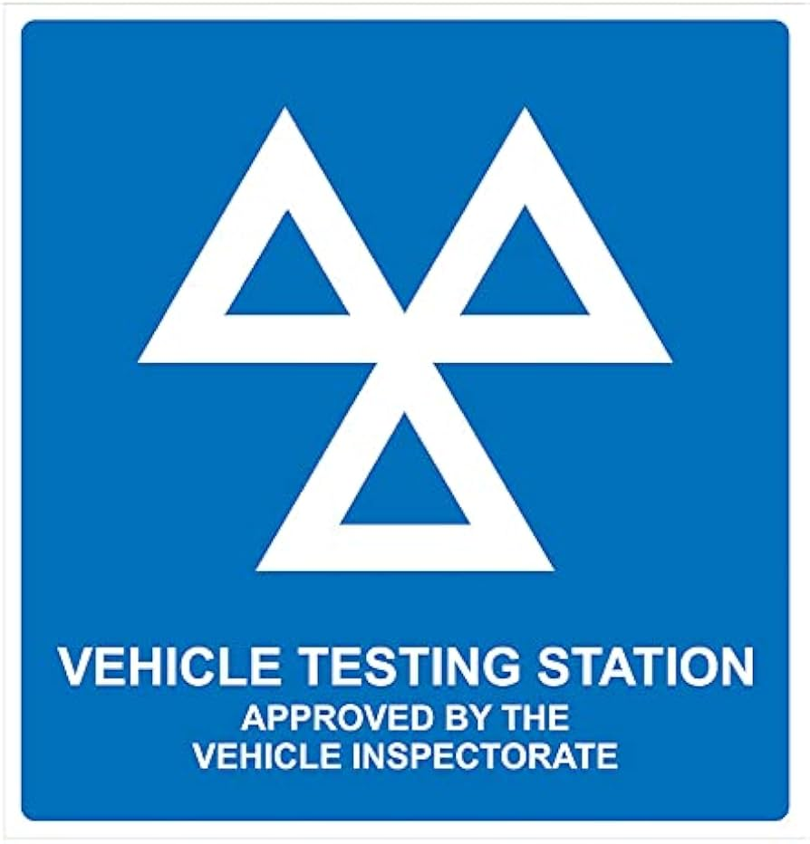 The official sign of a DVSA-approved test station, three white triangles on a blue background. Underneath triangles is white text VEHICLE TESTING STATION APPROVED BY THE VEHICLE INSPECTORATE.